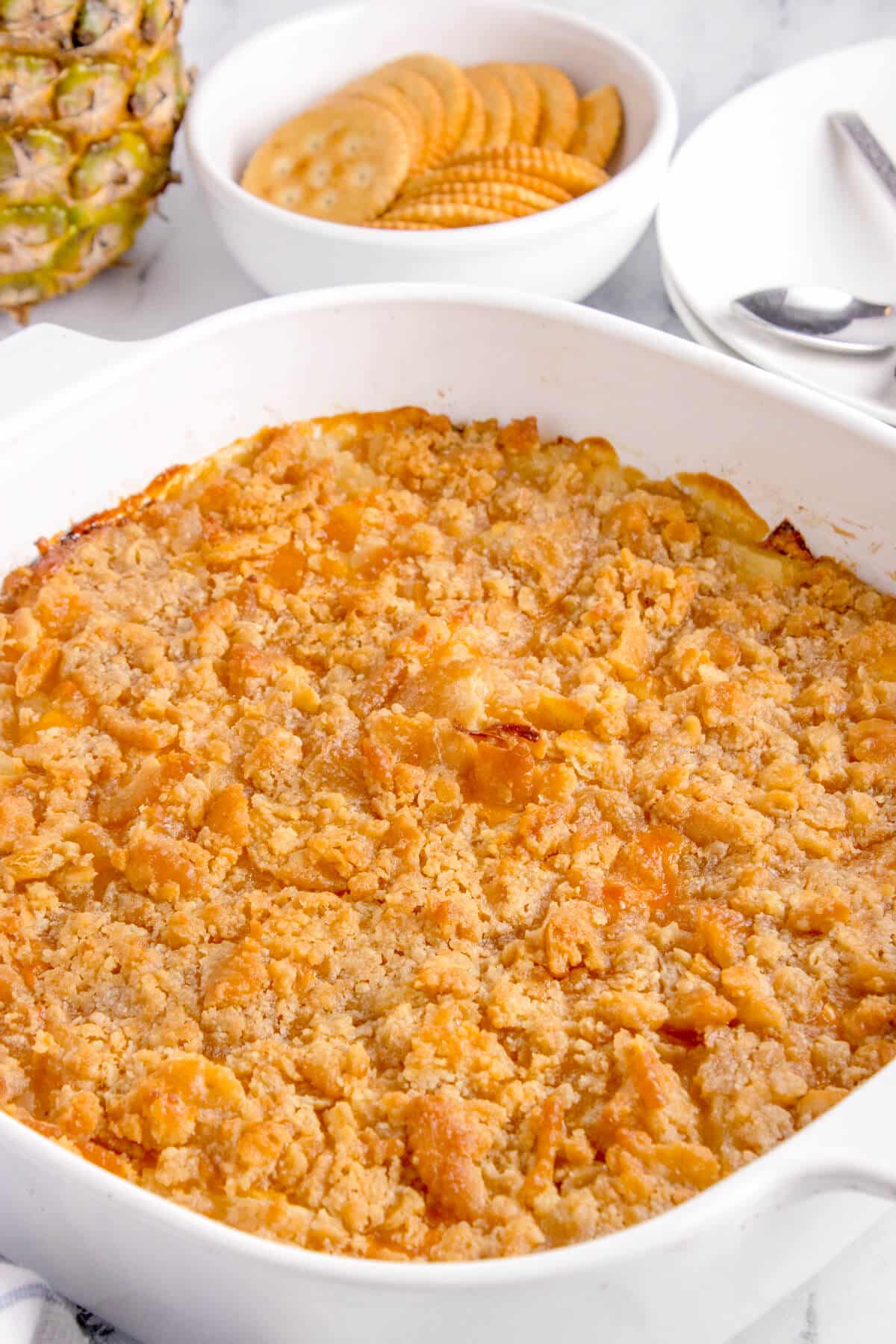 Pineapple casserole in a white pan.