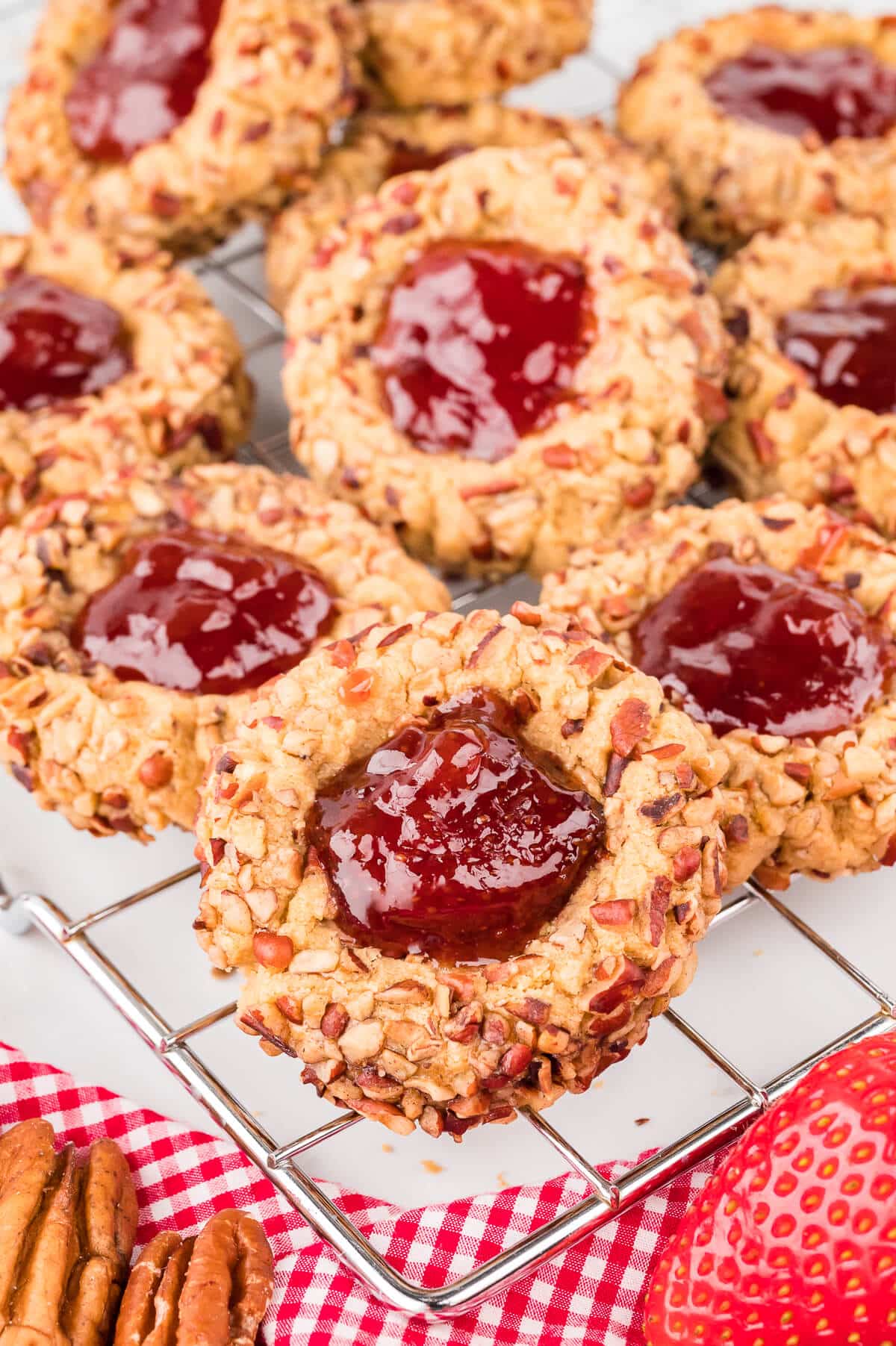 Thumbprint cookies on a wire rack.