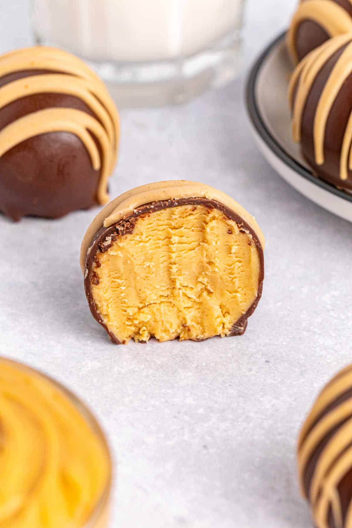 A chocolate peanut butter ball with a bite out of it.