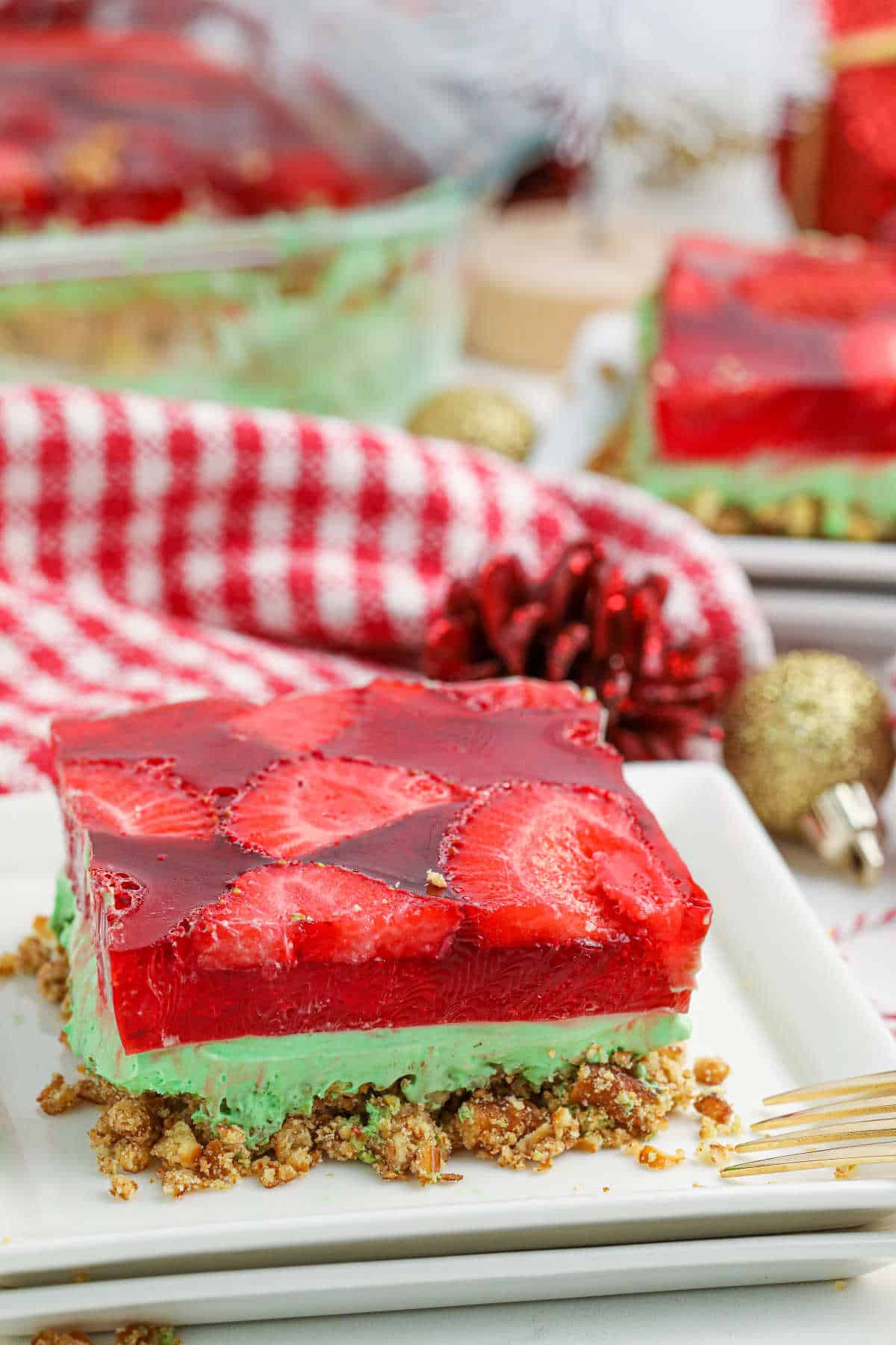 A slice of Christmas pretzel salad on a plate.