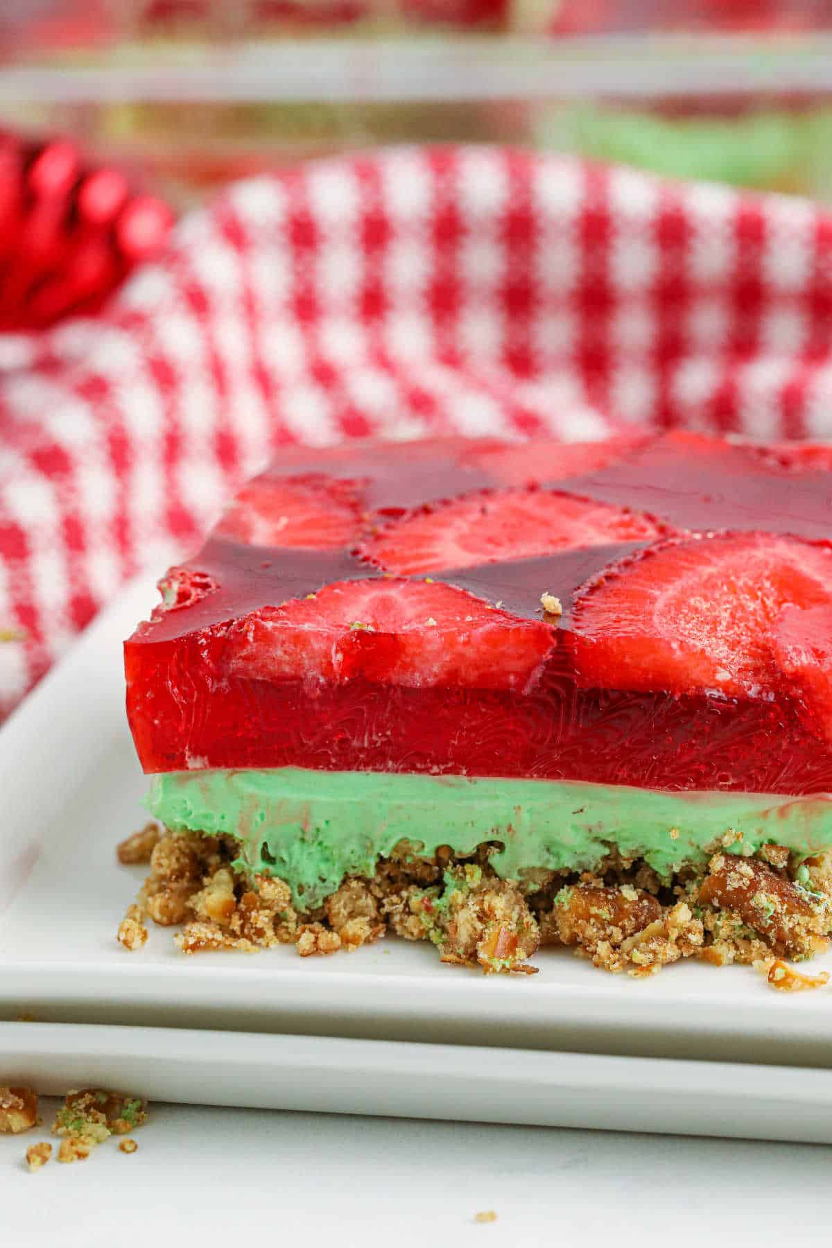 A slice of Christmas Pretzel Salad on a plate.