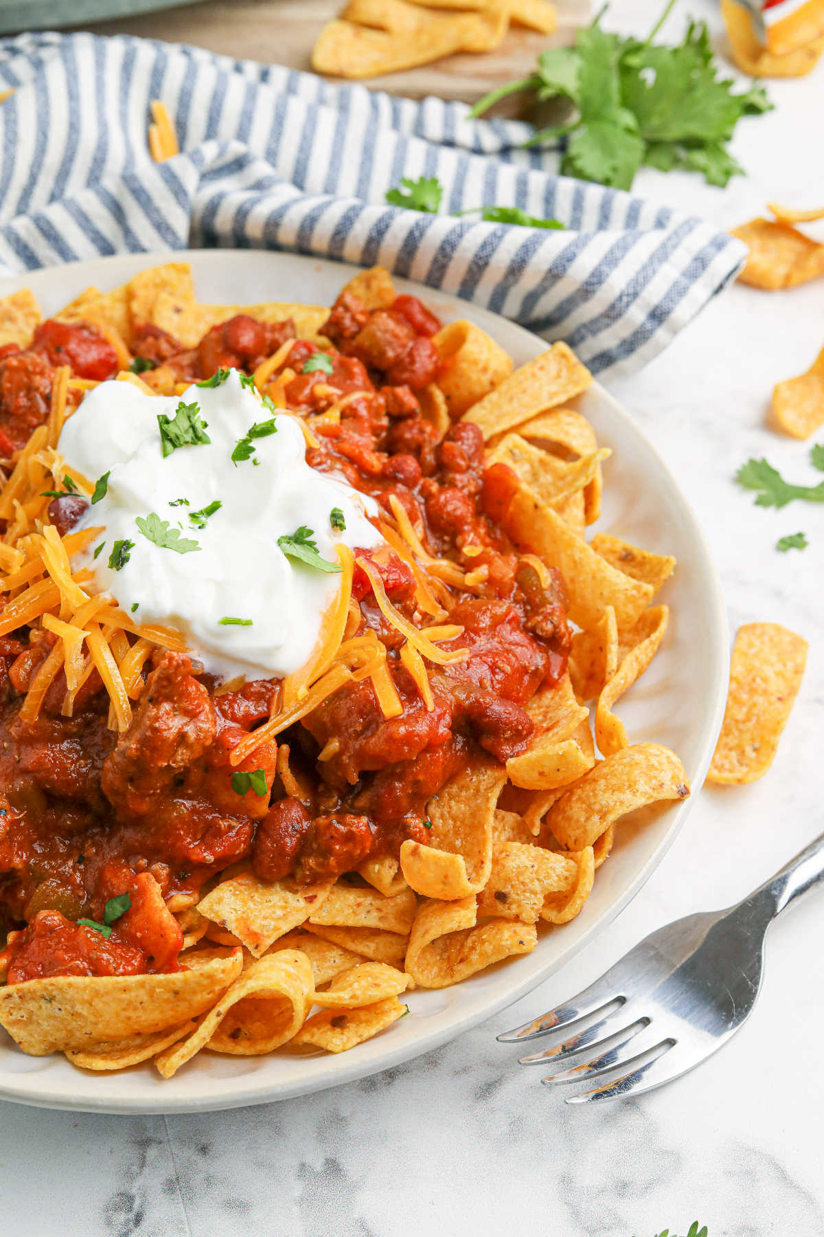 Frito chili pie on a plate.