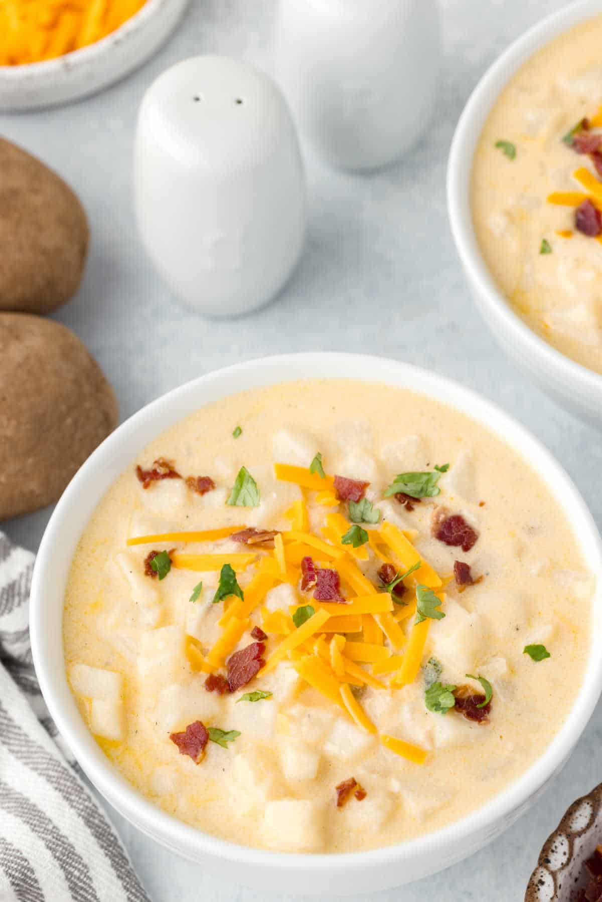 A bowl of hash brown potato soup.