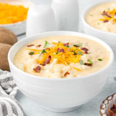 A white bowl of soup.