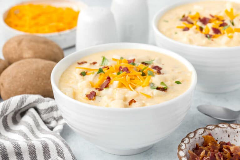 A white bowl of soup.