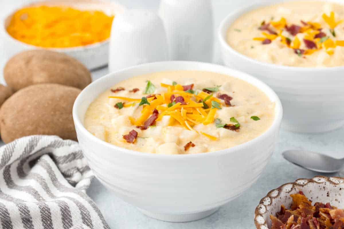 A bowl of hash brown potato soup.