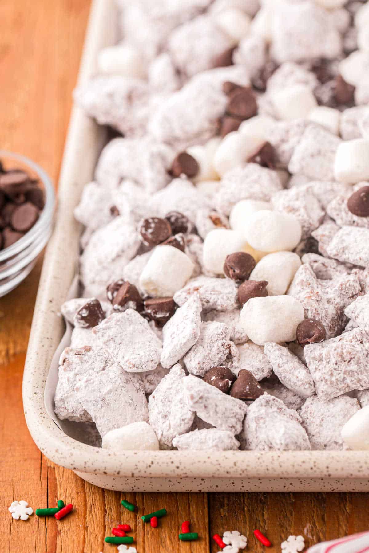 Hot chocolate muddy buddies on a baking sheet.