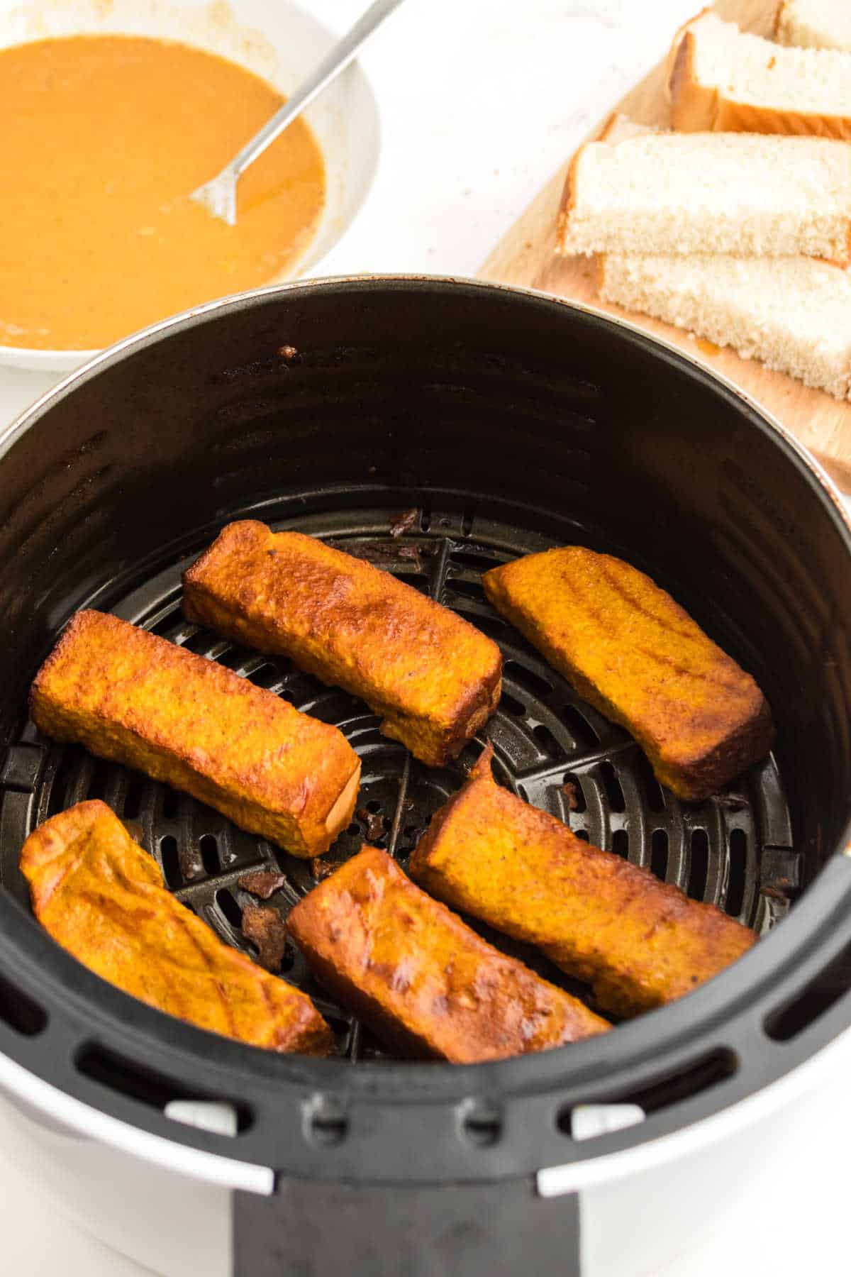 Pumpkin French toast sticks in an air fryer.