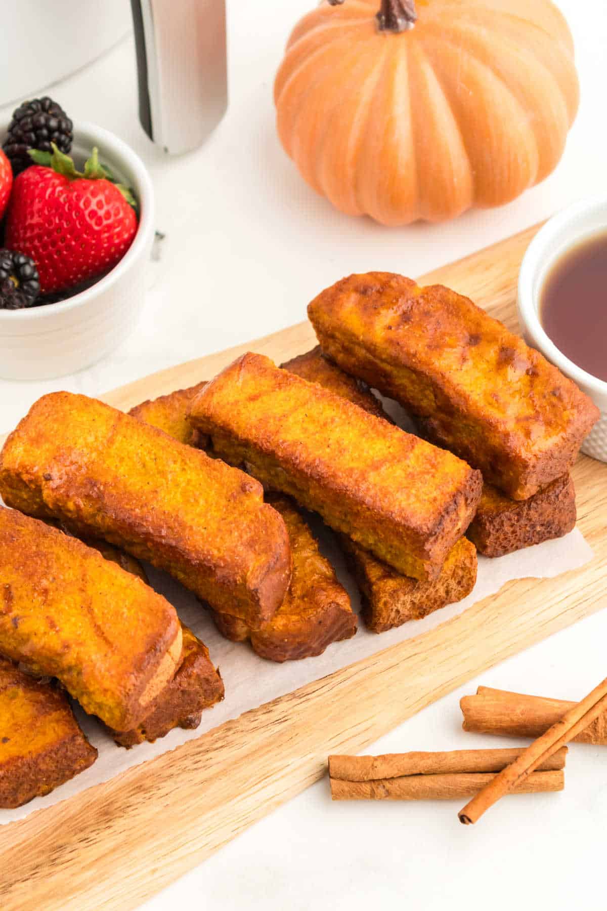 A pile of air fryer pumpkin french toast sticks.