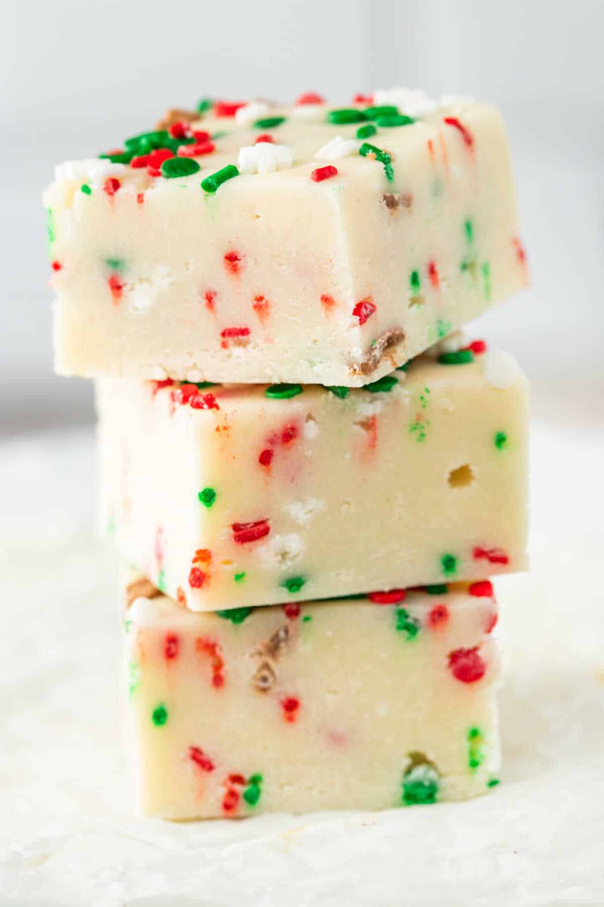 A stack of Christmas sugar cookie fudge.