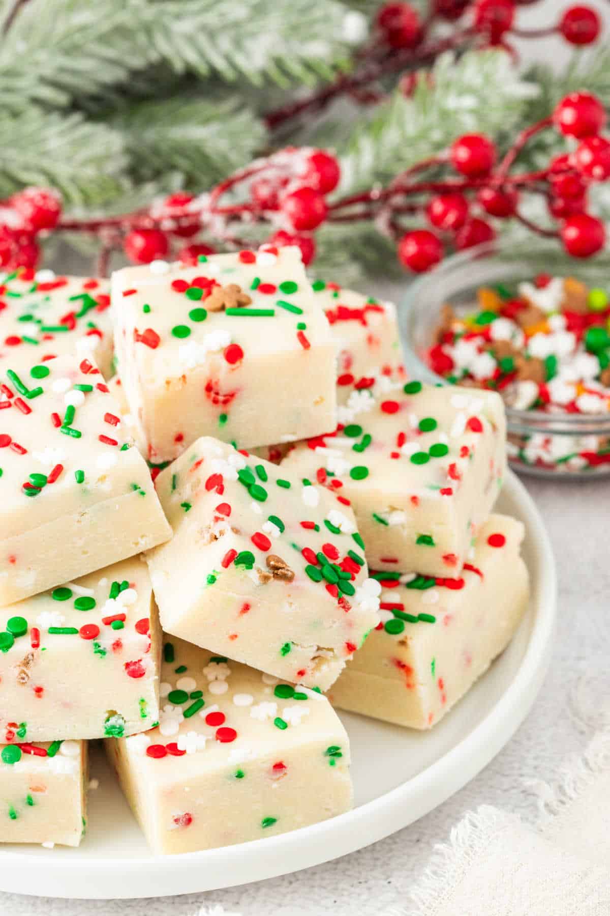 Christmas sugar cookie fudge on a plate.