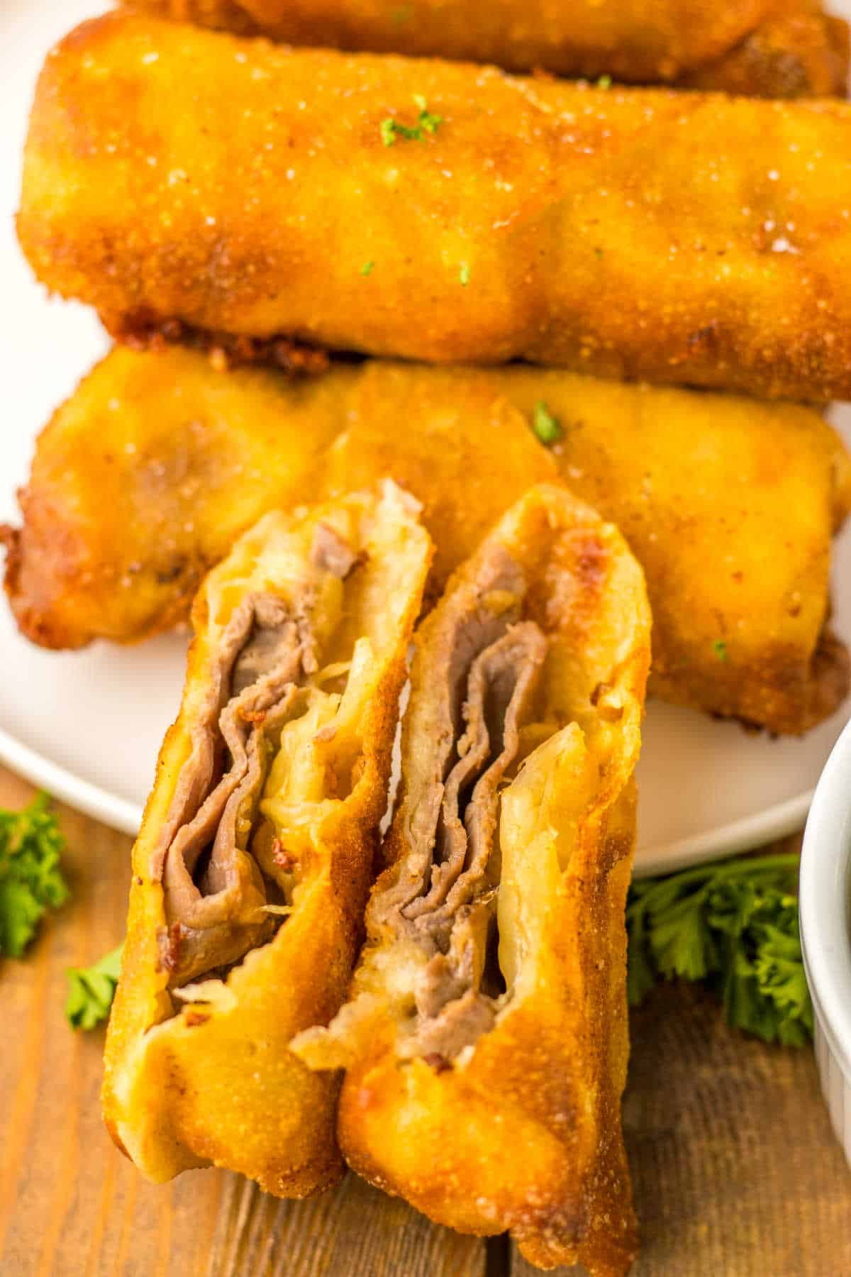 A French dip egg roll cut in half.