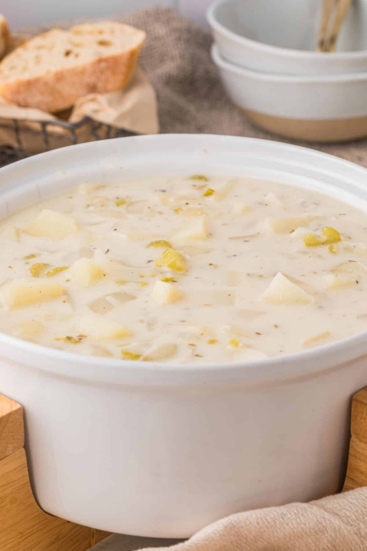 A white pot of German potato soup.