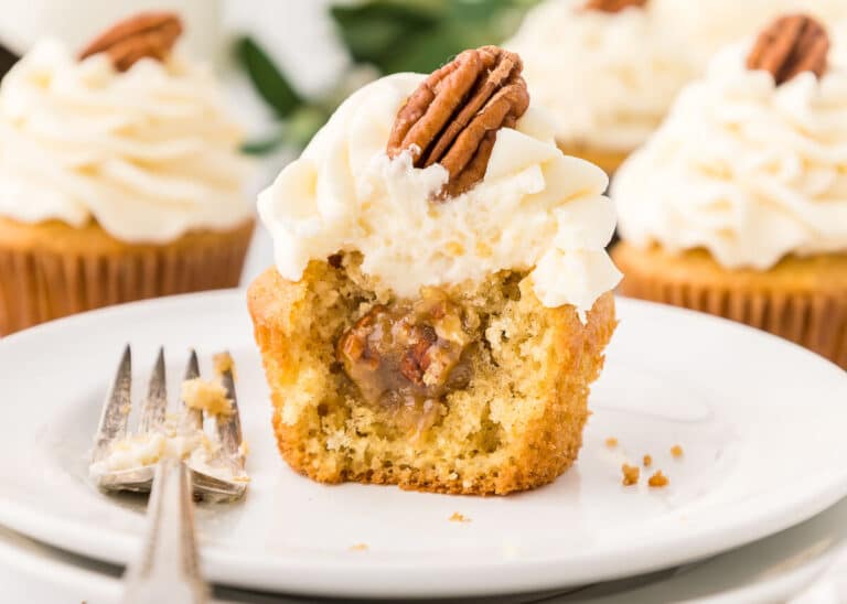 A cupcake on a plate.