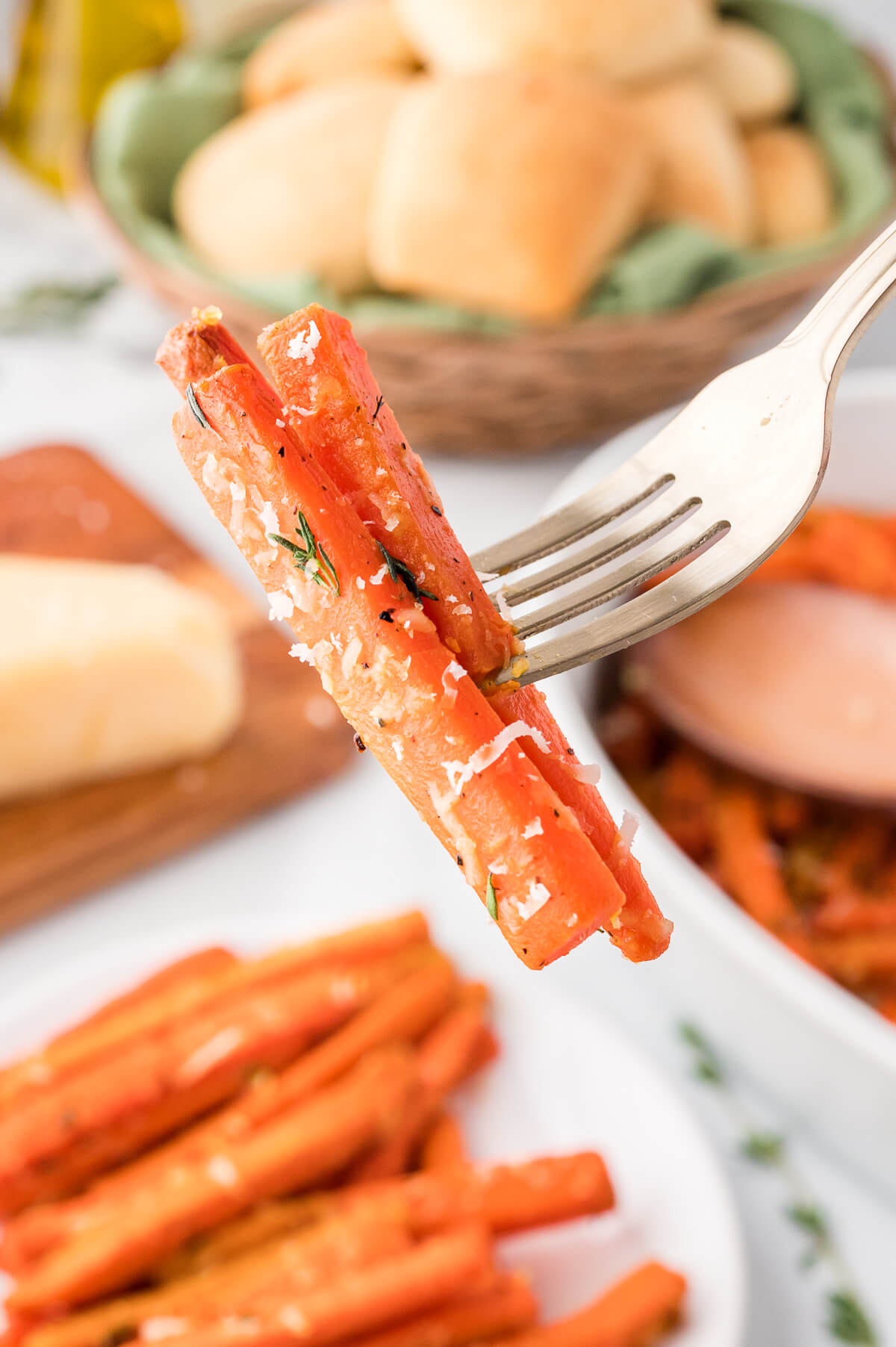 Parmesan roasted carrots on a fork.