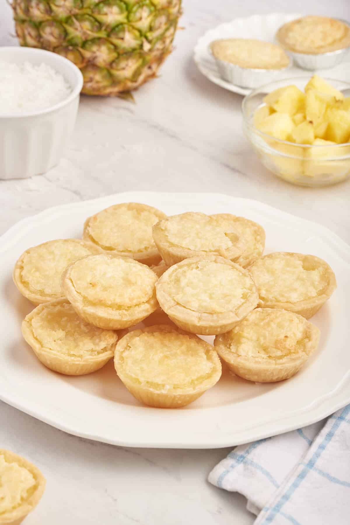 Pineapple tarts on a plate.