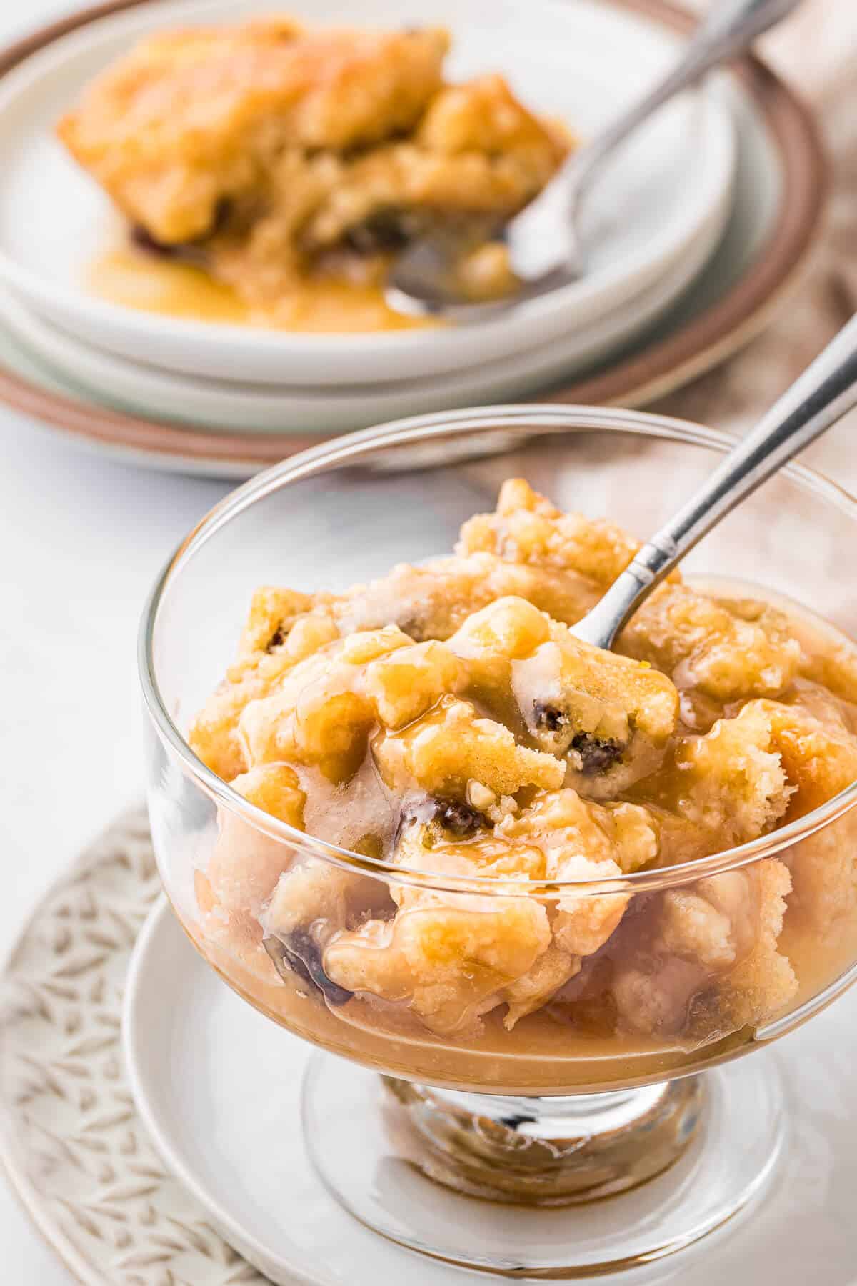 Radio pudding in a parfait dish with a spoon.