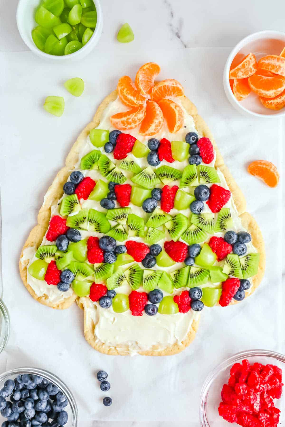 Sugar cookie Christmas tree on a white surface.