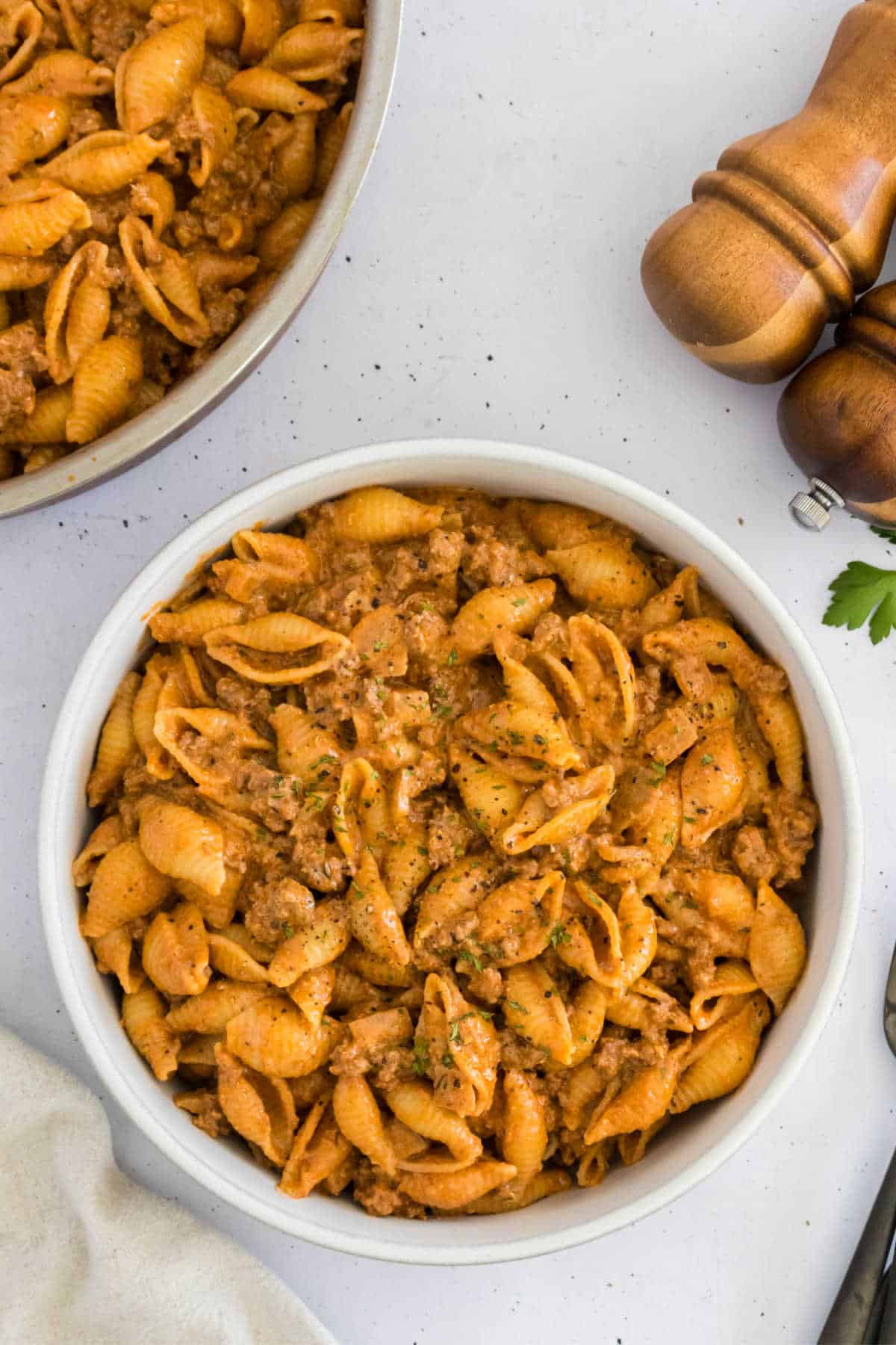 Creamy beef and shells in a bowl.