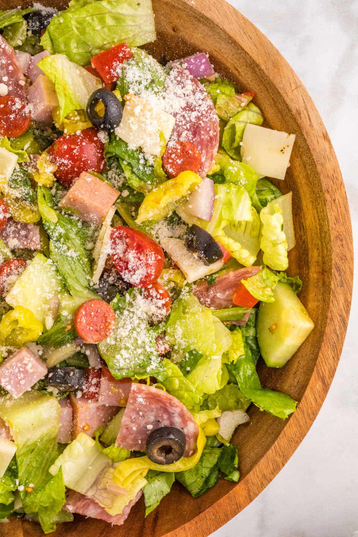 Italian sub salad in a wooden bowl