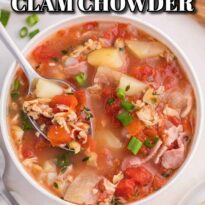 Manhattan clam chowder in a bowl with a spoon.