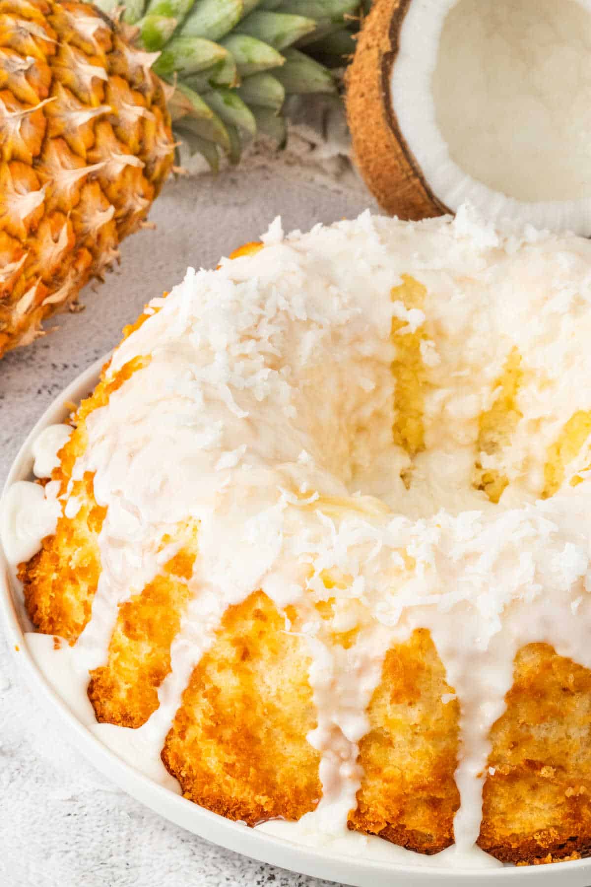 Pineapple coconut bundt cake on a platter.