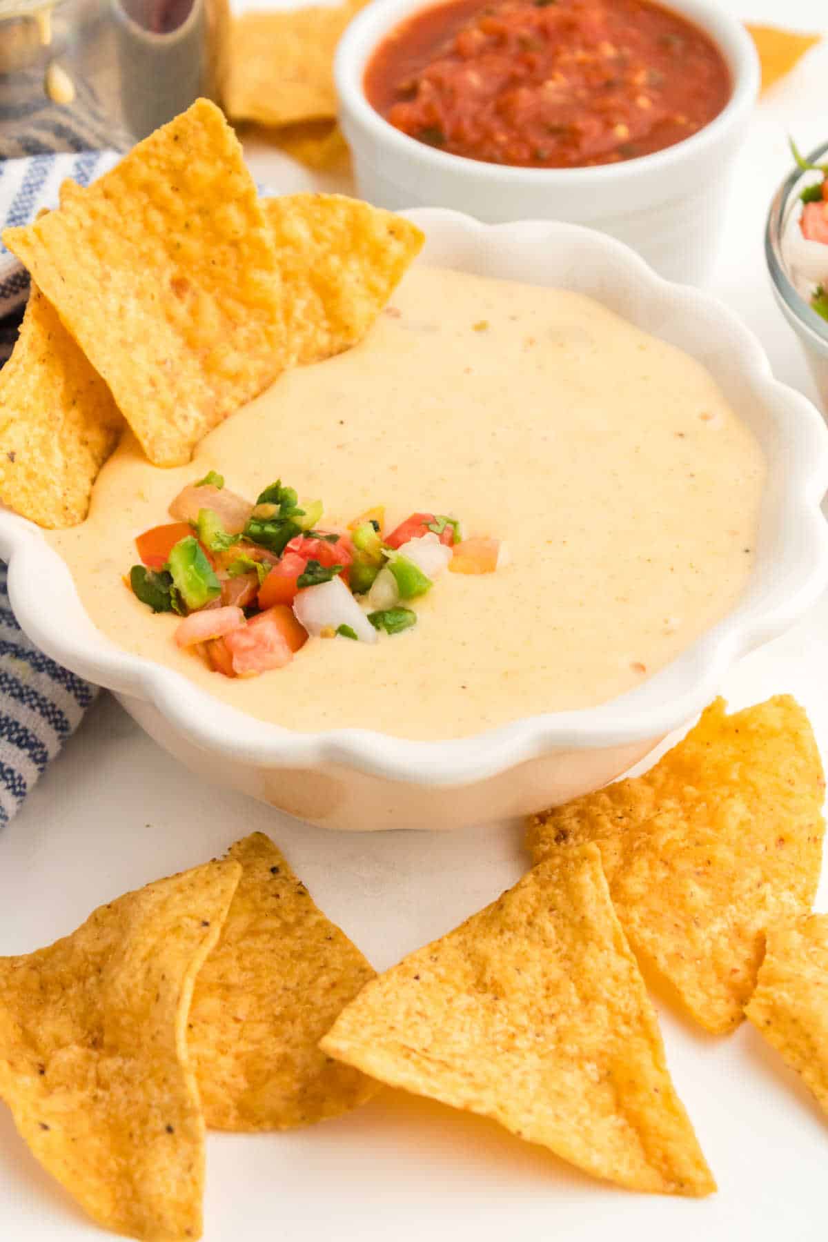 Queso dip with tortilla chips.