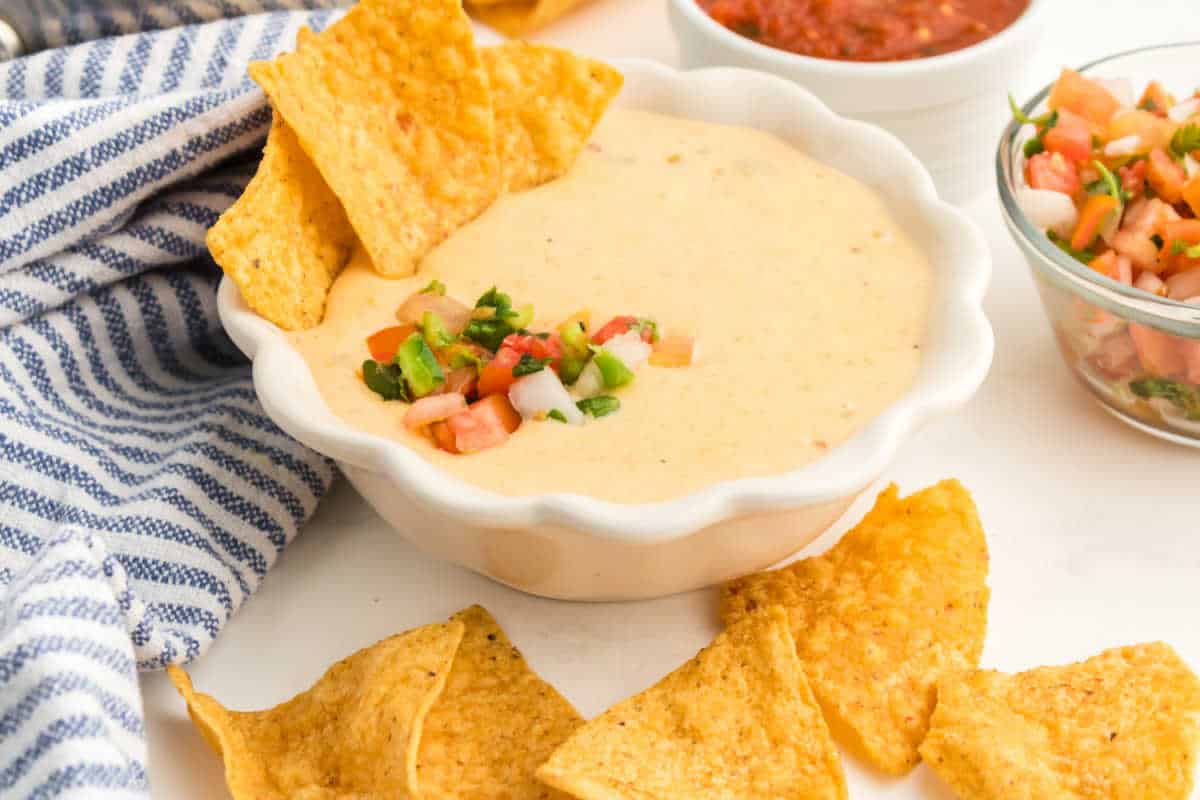 Queso dip with tortilla chips.