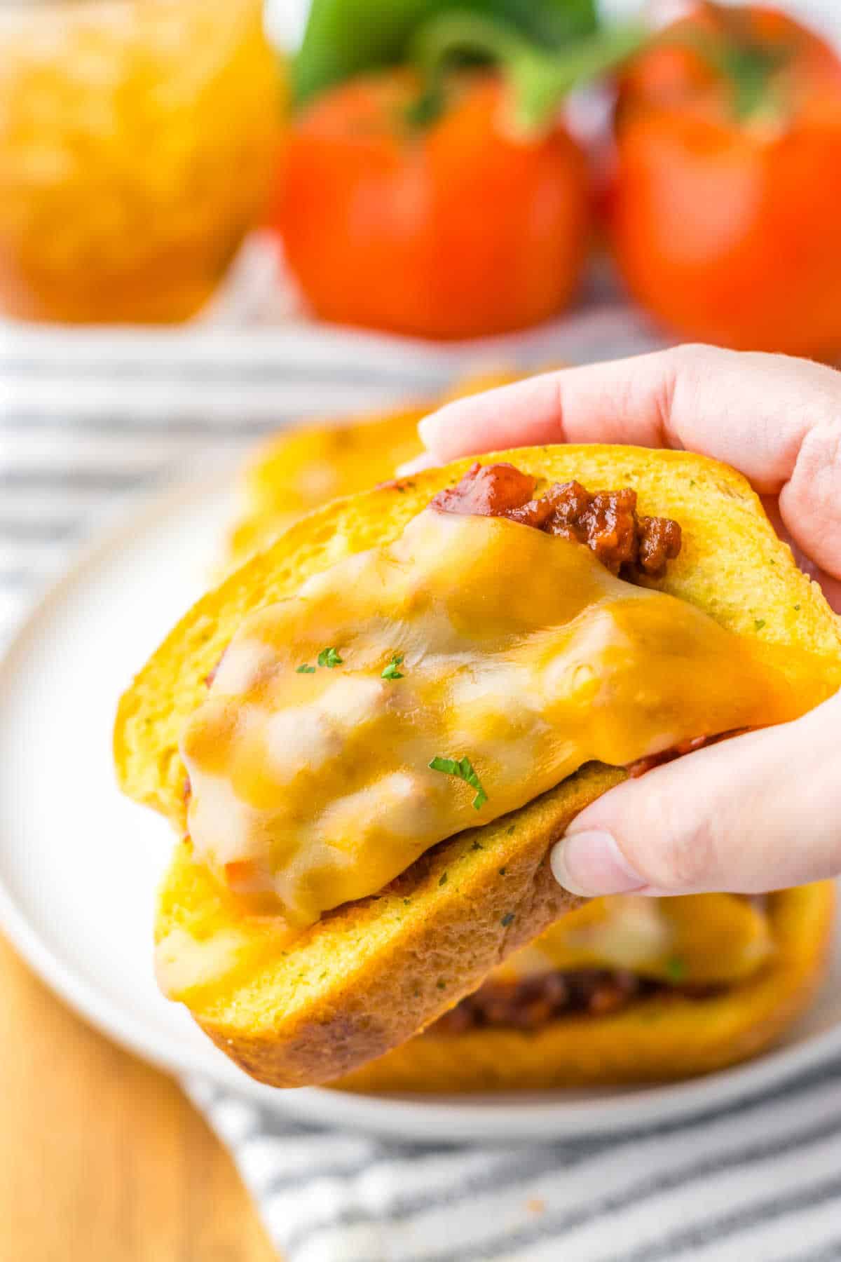 Get ready for a cozy and quick weeknight dinner in just 30 minutes with these Texas Toast Sloppy Joes, featuring gooey cheese and savory ground beef in a homemade sloppy joe sauce nestled on garlic Texas Toast. It's a family favorite, providing a fun twist on a classic and baked to easy, quick perfection, making it the perfect upgrade for your weeknight meals.