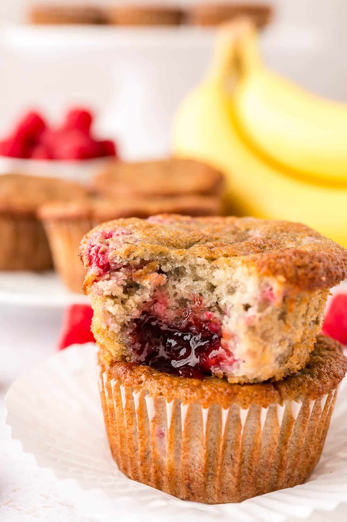 A stack of banana raspberry muffins.