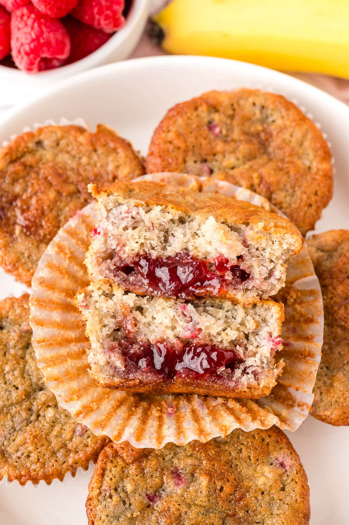 A banana raspberry muffin cut in half.