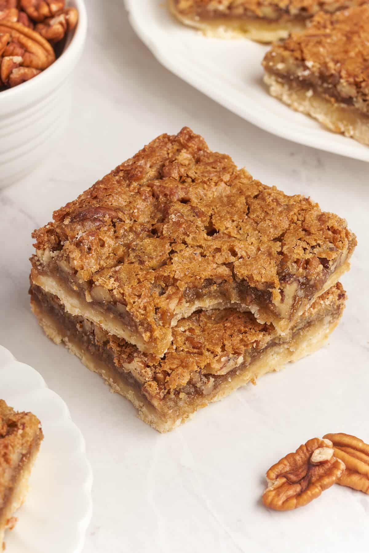 A butter tart square with a bite out of it.