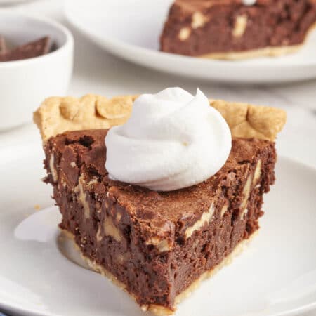 A slice of pie on a plate.
