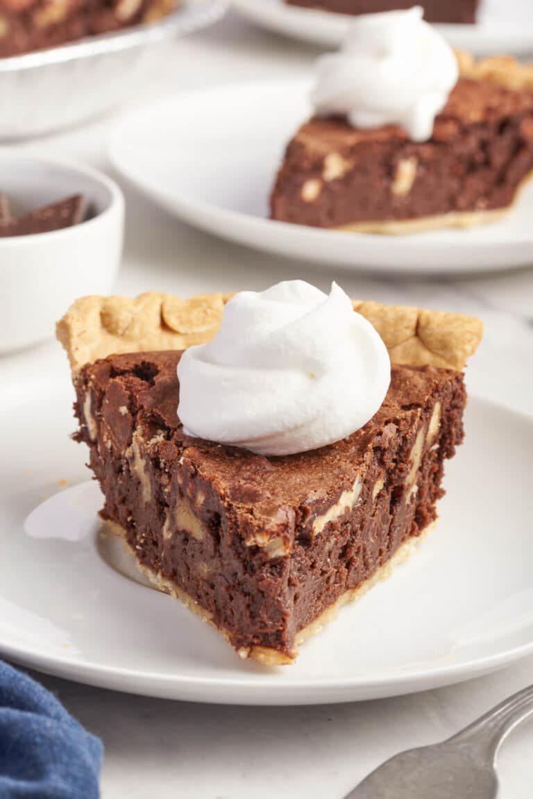 A slice of pie on a plate.