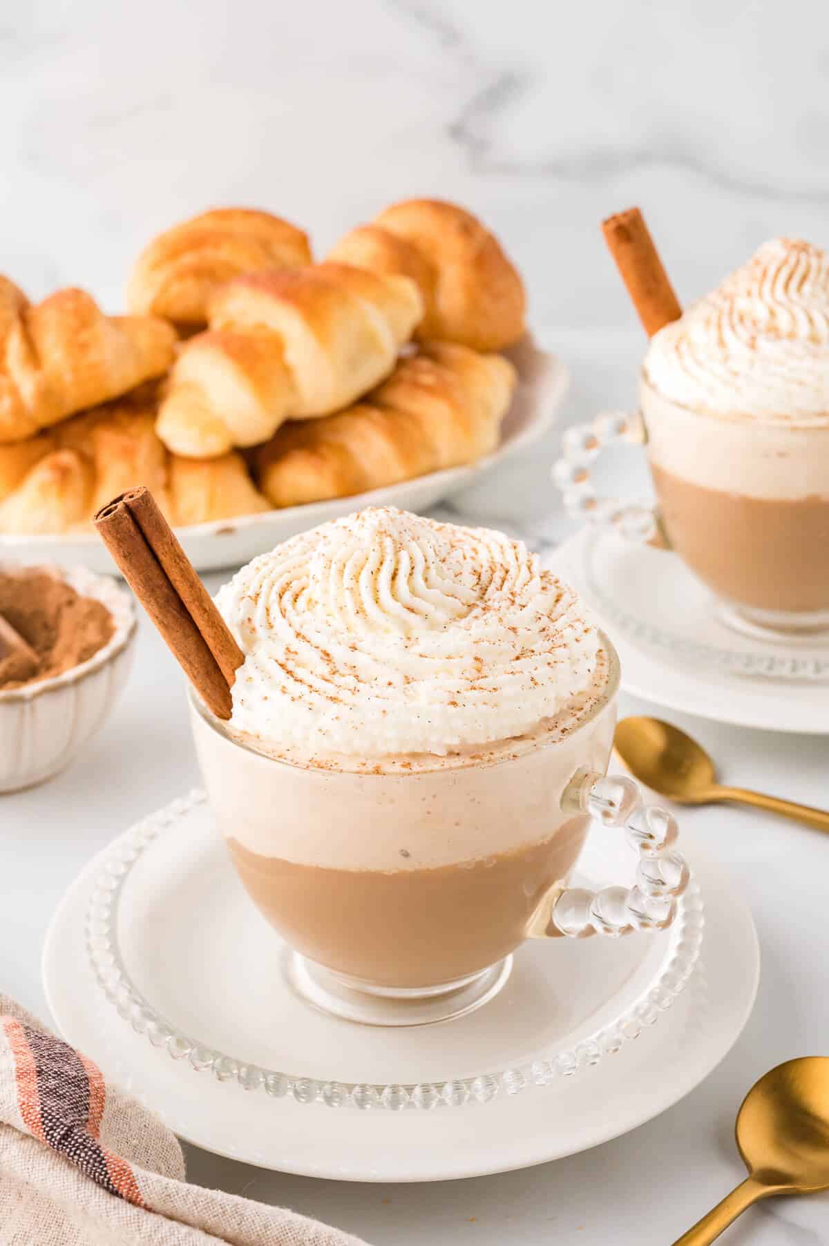 Cinnamon cappuccino on a plate.