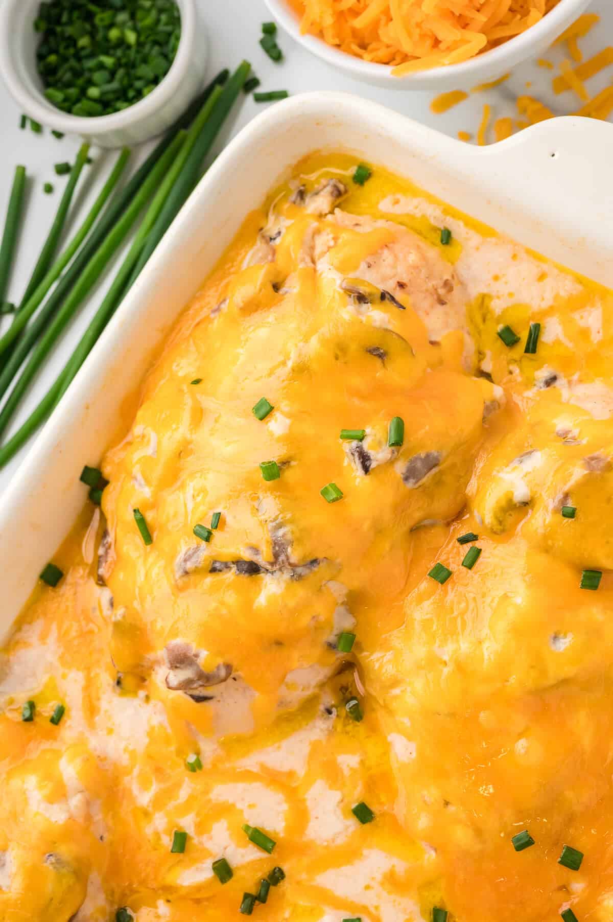 Sour cream chicken bake in a white casserole dish.