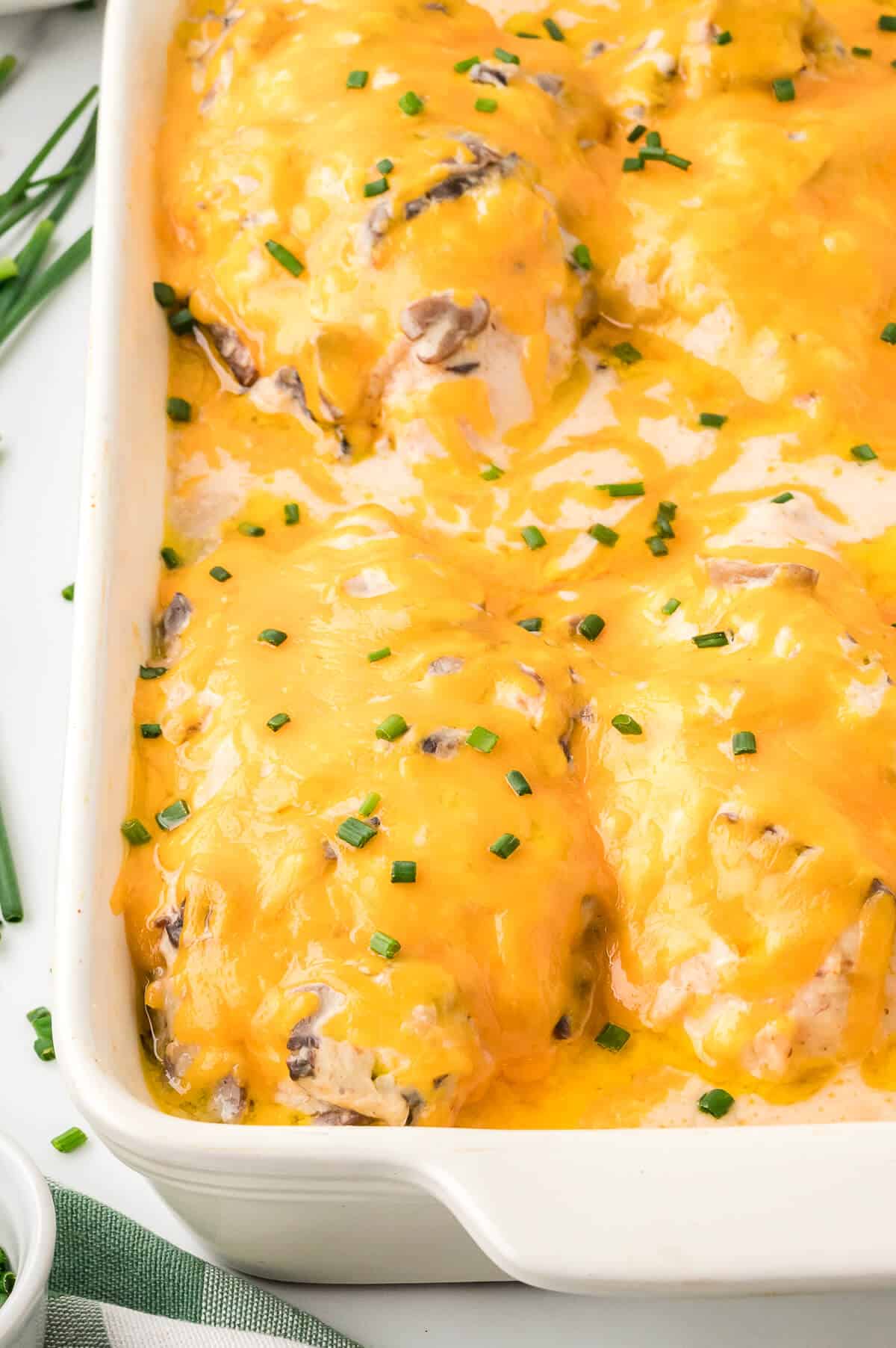 Sour cream chicken bake in a white casserole dish.