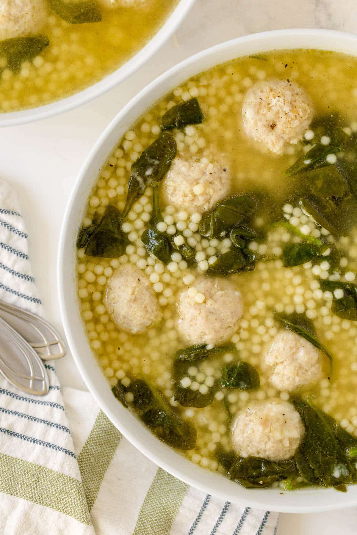 Italian meatball soup in a bowl.