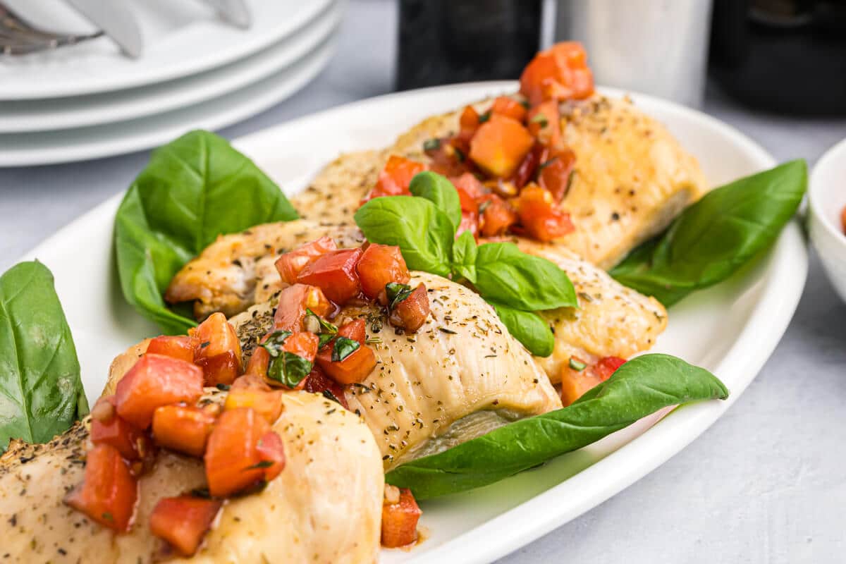 Bruschetta chicken on a platter.