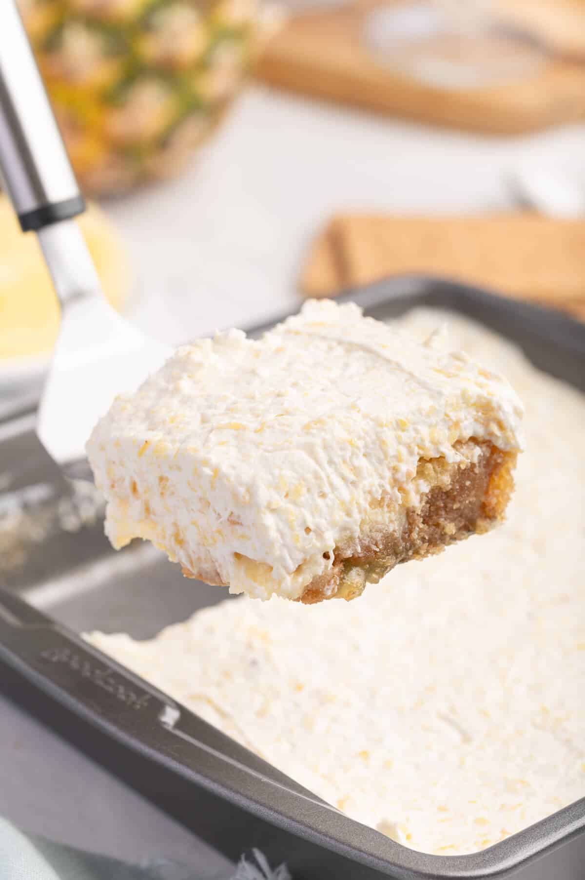 A slice of pineapple delight on a spatula.