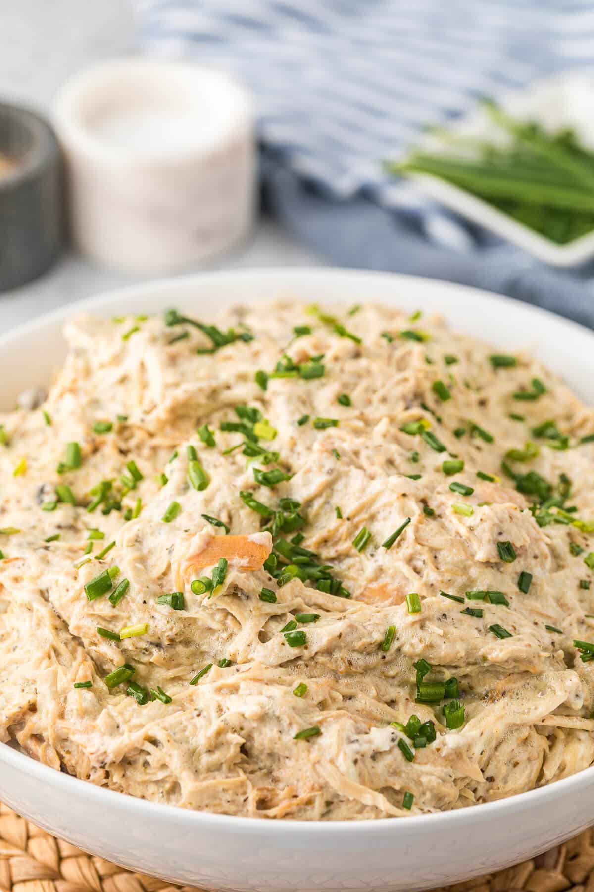 Slow cooker cream cheese chicken in a bowl.