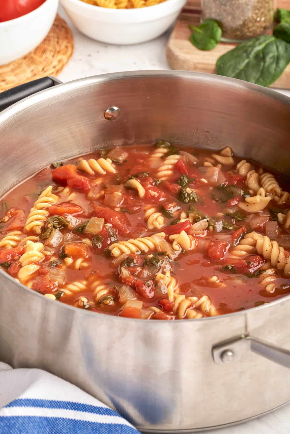 A pot of tomato florentine soup.