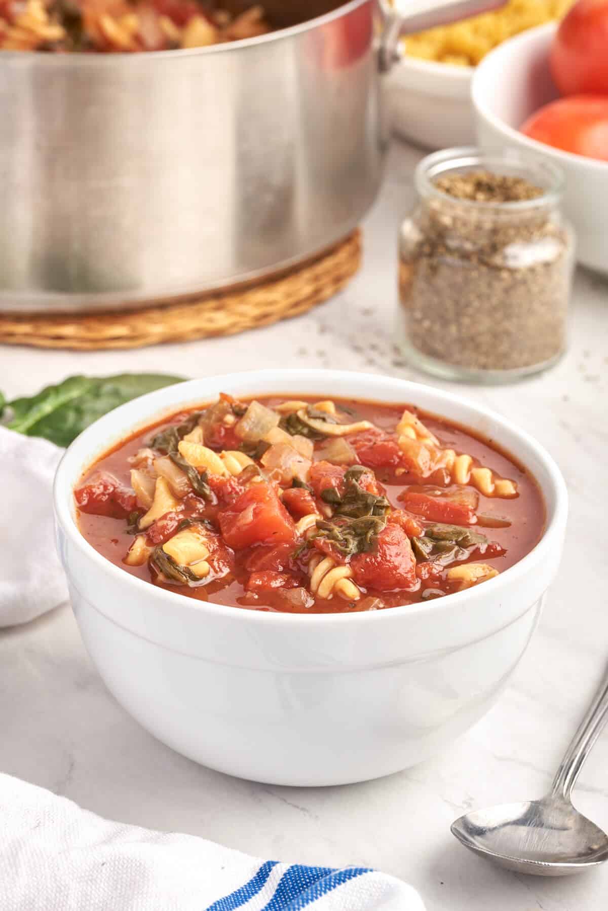 A bowl of tomato florentine soup. 