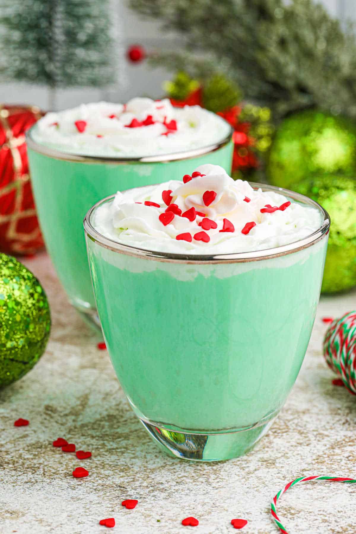 Grinch mint cocktail in a glass mug.