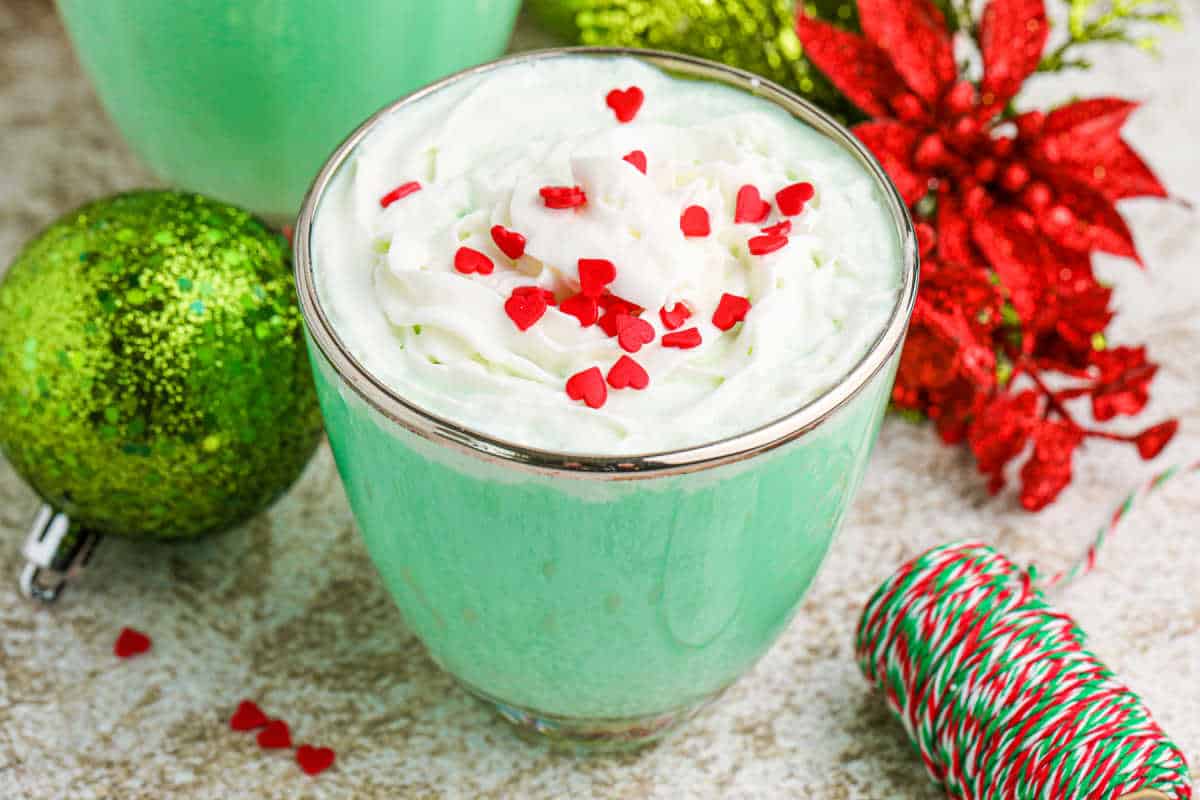 Grinch mint cocktail in a glass mug.