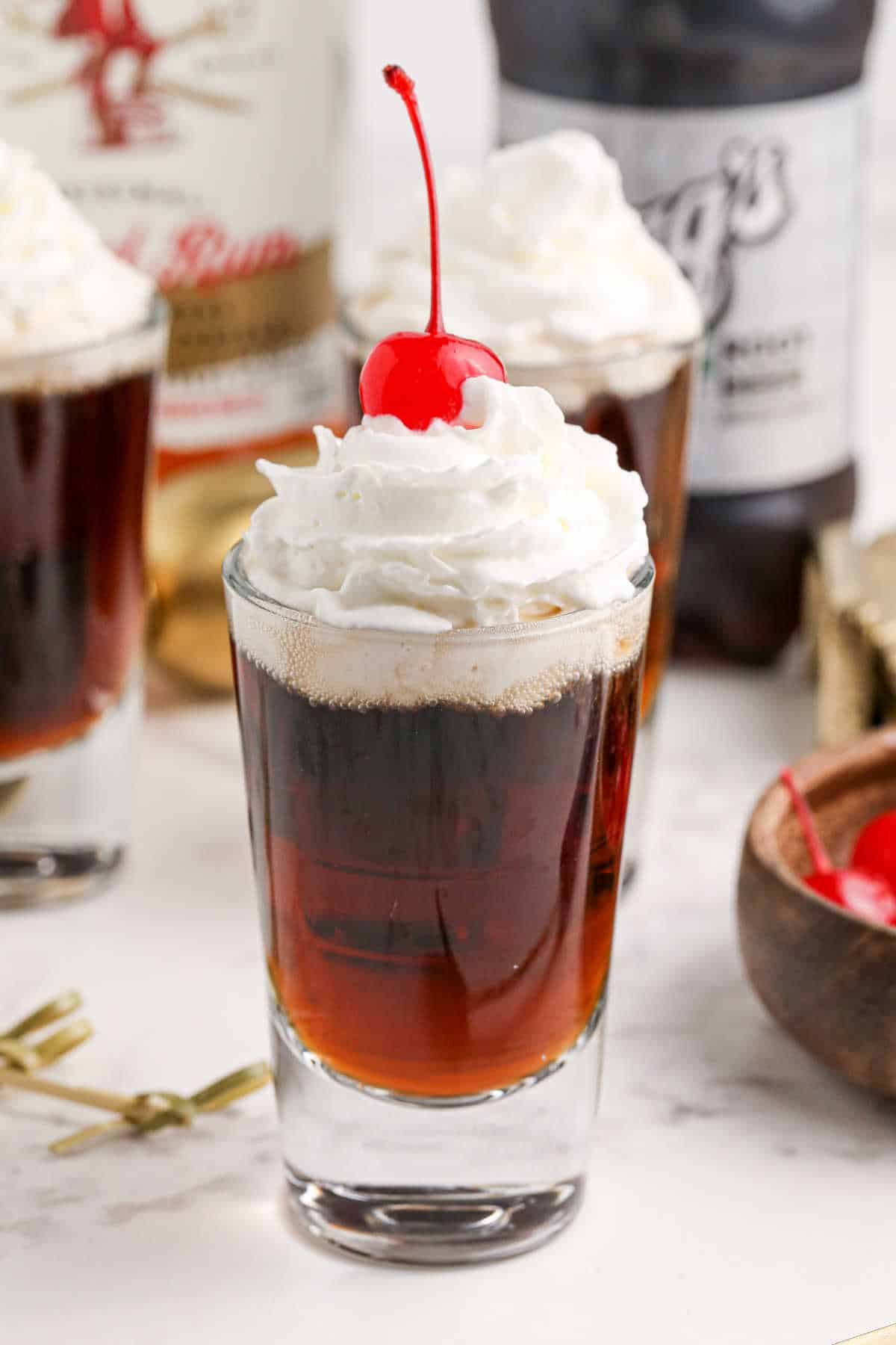 A root beer shooter on a counter.