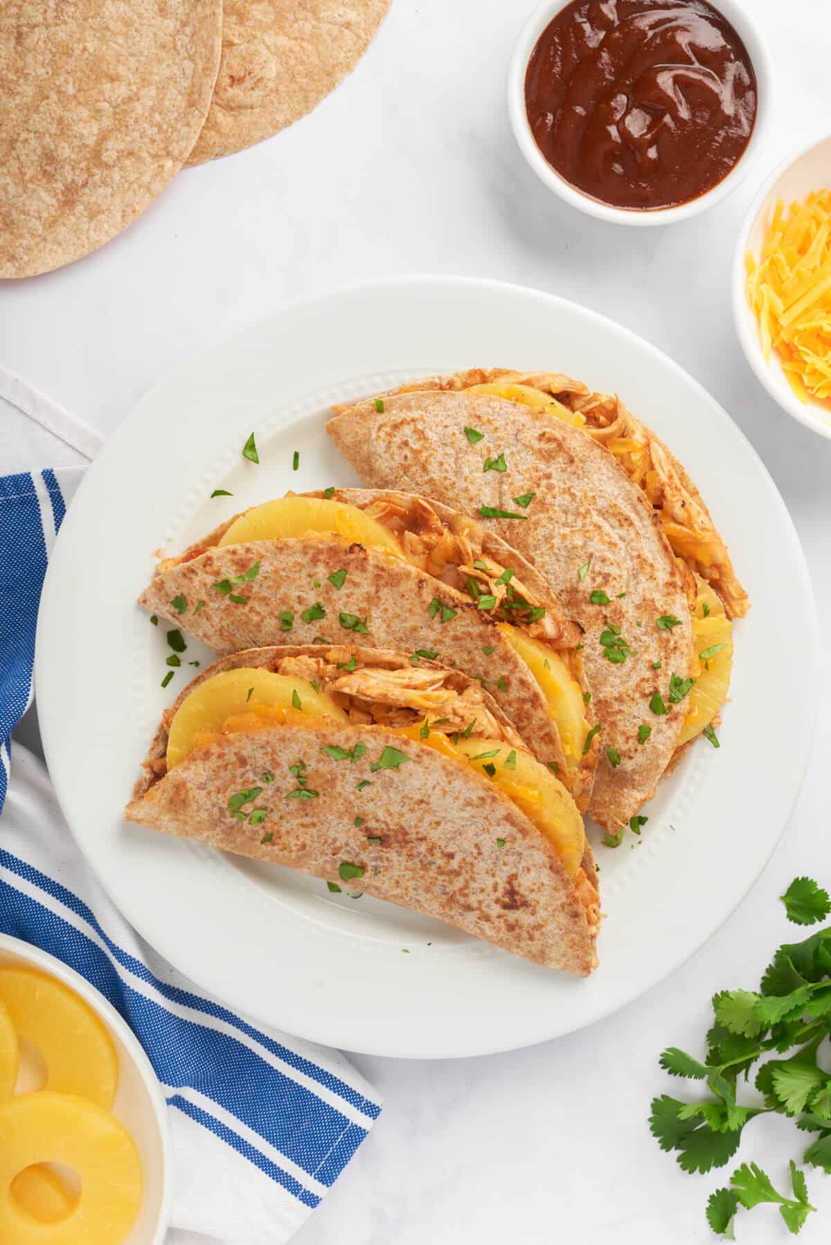 BBQ Chicken and pineapple quesadillas on a plate.