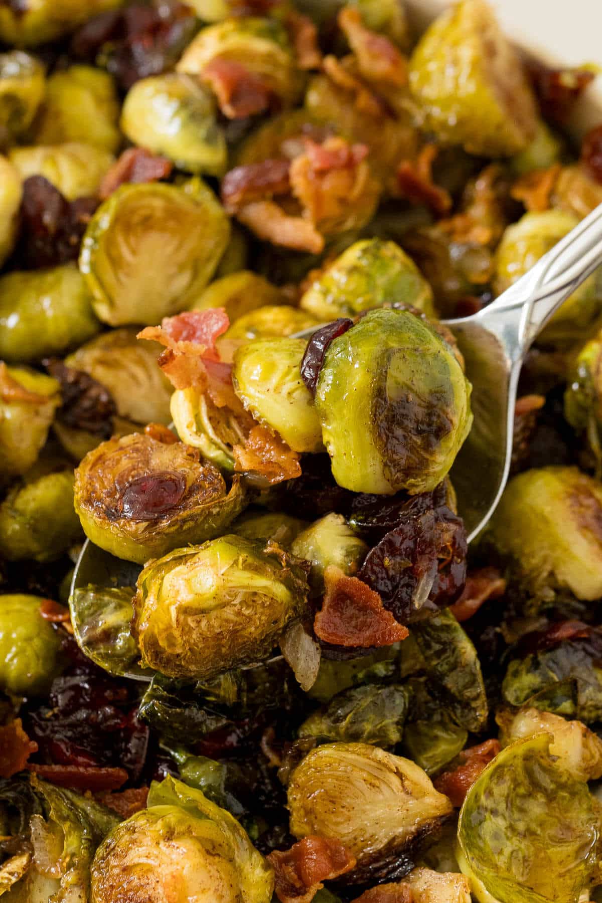 Roasted brussel sprouts on a serving spoon.