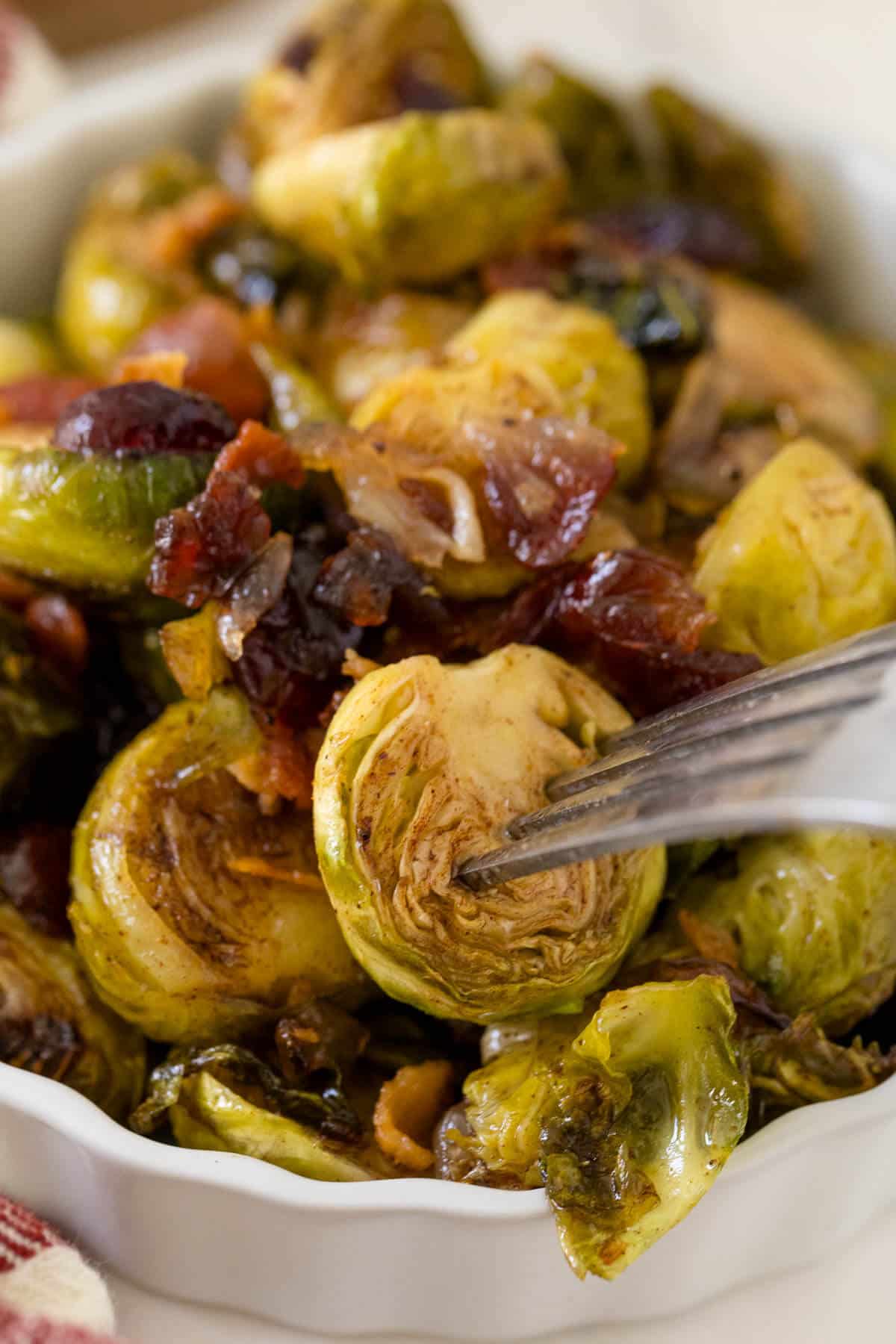 Roasted brussel sprouts on a fork.