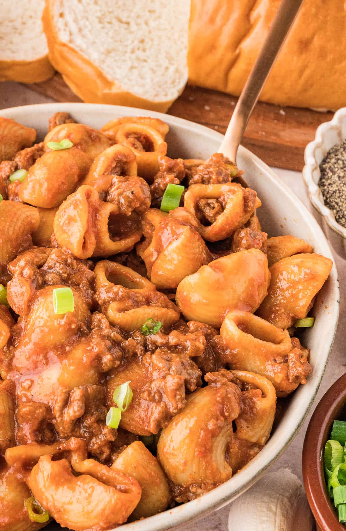 Grandma's Goulash in a bowl with a spoon.